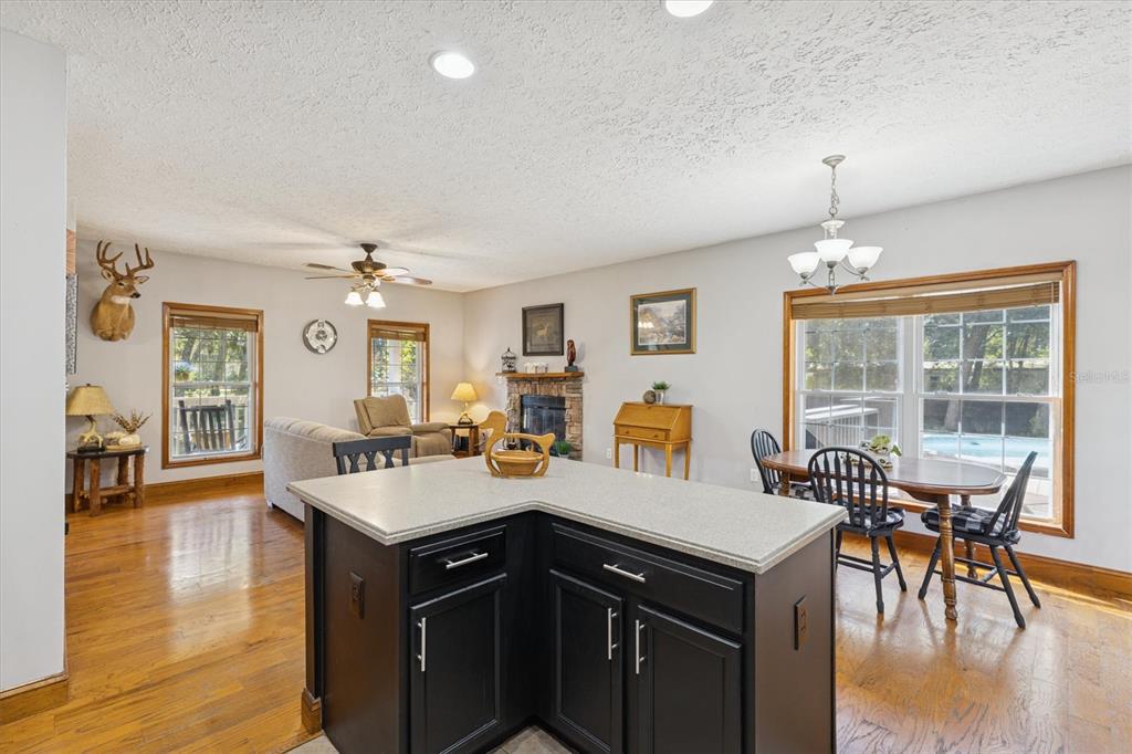 16607 Bearle Road Orlando, FL 32828 - Photo 30 of 57 a view of a dining room with furniture window and wooden floor