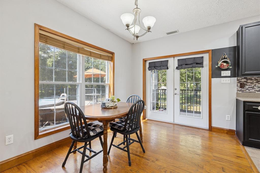 16607 Bearle Road Orlando, FL 32828 - Photo 35 of 57 a view of a dining room with furniture window and wooden floor