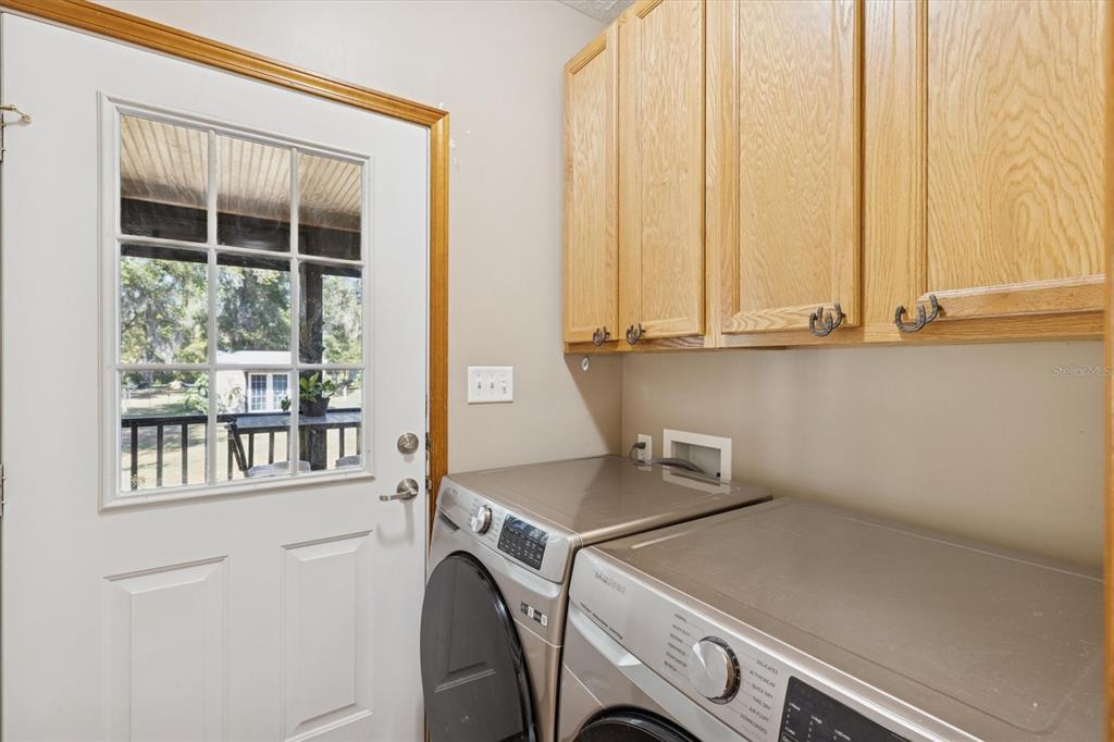 16607 Bearle Road Orlando, FL 32828 - Photo 37 of 57 a utility room with dryer and washer
