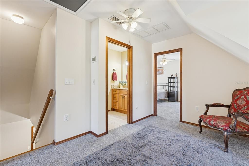 16607 Bearle Road Orlando, FL 32828 - Photo 43 of 57 a view of a livingroom with furniture and a hallway
