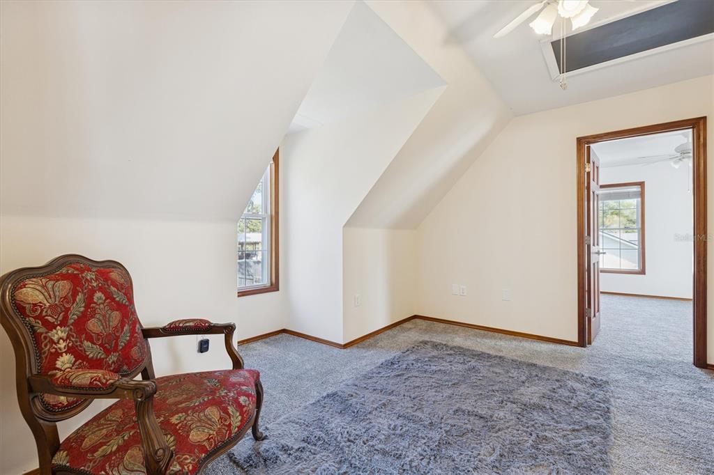 16607 Bearle Road Orlando, FL 32828 - Photo 44 of 57 a living room with furniture and stairs