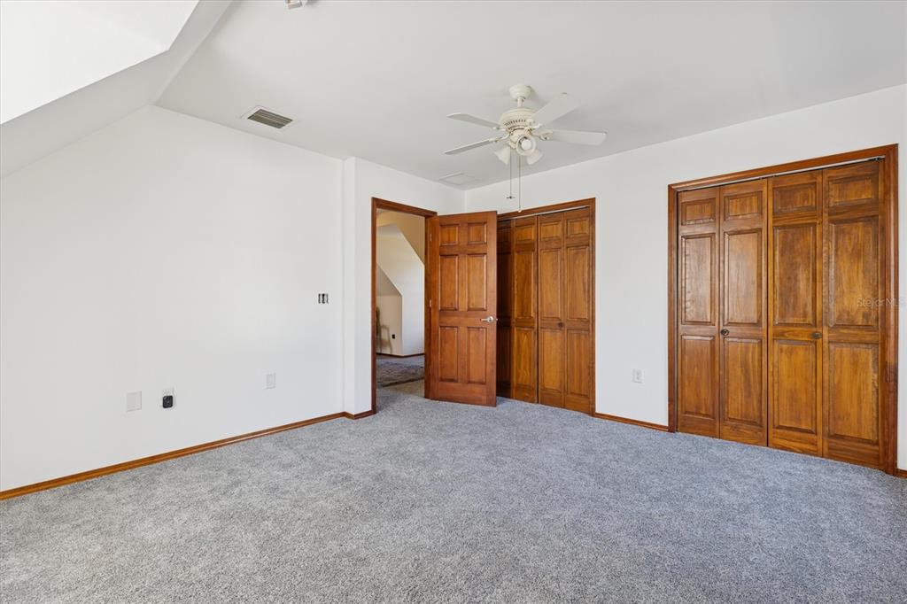 16607 Bearle Road Orlando, FL 32828 - Photo 50 of 57 an empty room with closet area