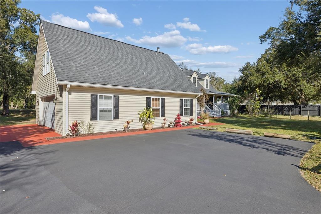 16607 Bearle Road Orlando, FL 32828 - Photo 5 of 57 a view of a house with backyard and pool
