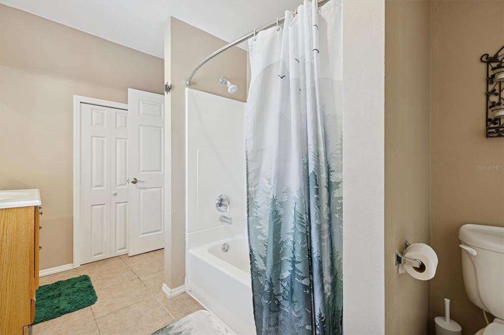 16607 Bearle Road Orlando, FL 32828 - Photo 57 of 57 a bathroom with a shower and a sink
