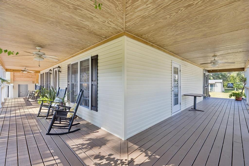 16607 Bearle Road Orlando, FL 32828 - Photo 8 of 57 a view of a backyard with sitting area