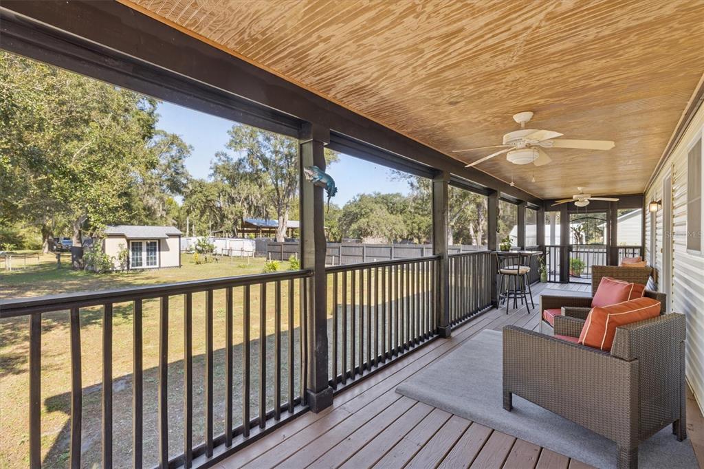 16607 Bearle Road Orlando, FL 32828 - Photo 9 of 57 a view of a porch with furniture