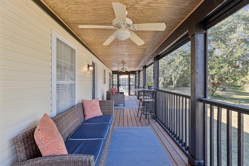16607 Bearle Road Orlando, FL 32828 - Photo 10 of 57 a living room with furniture and a large window