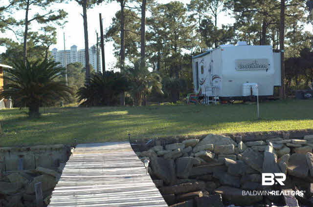 8599 West Fort Morgan Road West Gulf Shores, AL 36542 - Photo 3 of 17 view of property half way down pier.