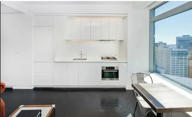 a room with furniture and a flat screen tv