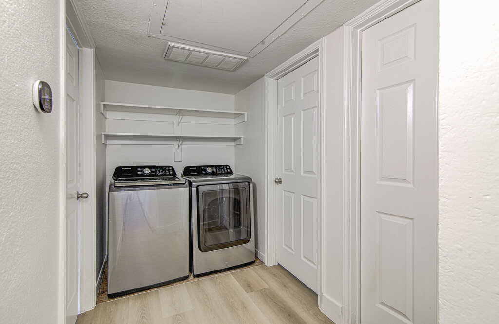 6713 West Gate Boulevard, Unit A Austin, TX 78745 - Photo 11 of 21 a utility room with dryer and washer