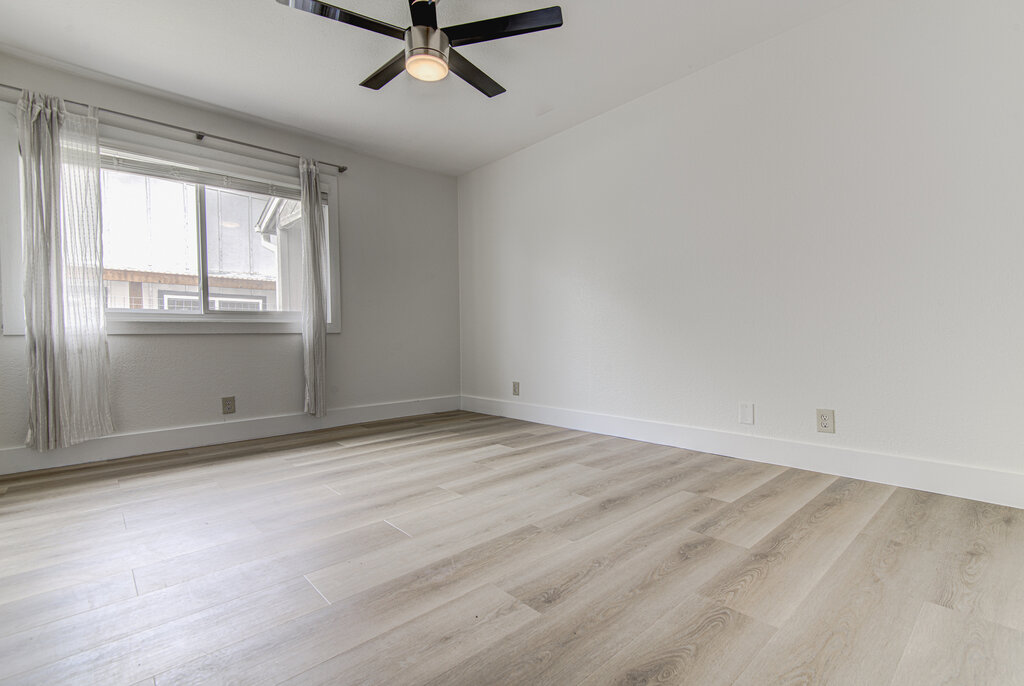 6713 West Gate Boulevard, Unit A Austin, TX 78745 - Photo 15 of 21 wooden floor in an empty room with a window