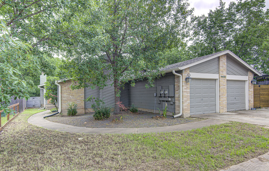 6713 West Gate Boulevard, Unit A Austin, TX 78745 - Photo 2 of 21 a view of a house with a yard and large tree