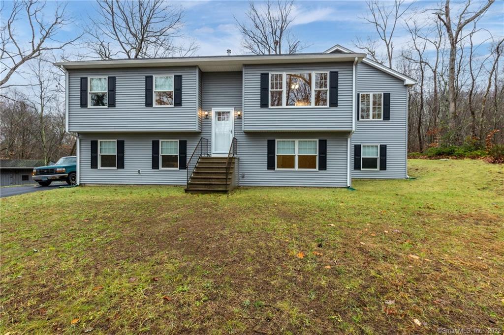 a front view of a house with a yard