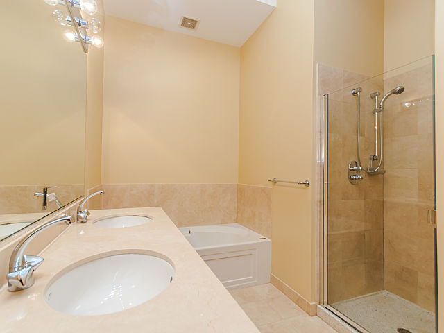 321 South Sangamon Street, Unit 901 Chicago, IL 60607 - Photo 13 of 18 a bathroom with a sink a toilet and shower
