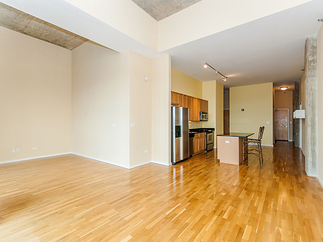 321 South Sangamon Street, Unit 901 Chicago, IL 60607 - Photo 6 of 18 a view of kitchen with furniture and wooden floor
