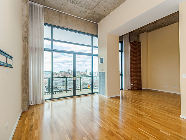 321 South Sangamon Street, Unit 901 Chicago, IL 60607 - Photo 7 of 18 wooden floor in an empty room with a window