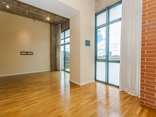 321 South Sangamon Street, Unit 901 Chicago, IL 60607 - Photo 8 of 18 a view of an empty room with wooden floor and a window