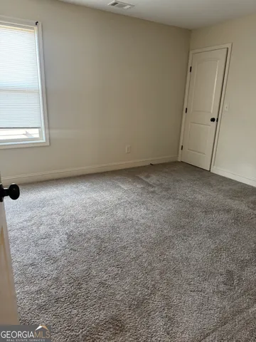 a view of a room that has a window in it