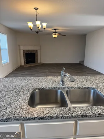 a sink with a granite top