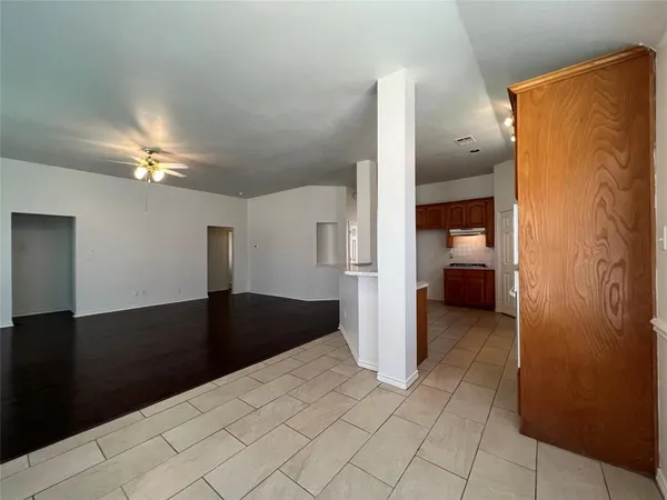 a view of a utility room with closet and windows