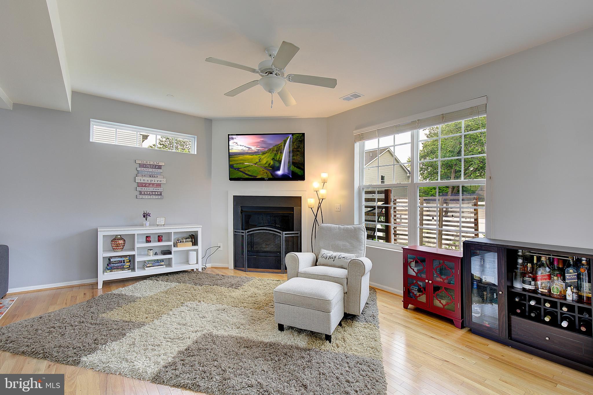 403 Venton Road Edgewater, MD 21037 - Photo 12 of 62 a living room with furniture and a fireplace