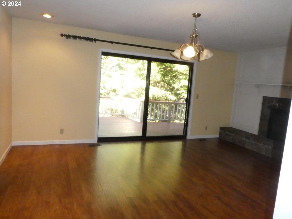 310 Southeast Terrace Drive Roseburg, OR 97470 - Photo 16 of 44 a view of room with window and wooden floor
