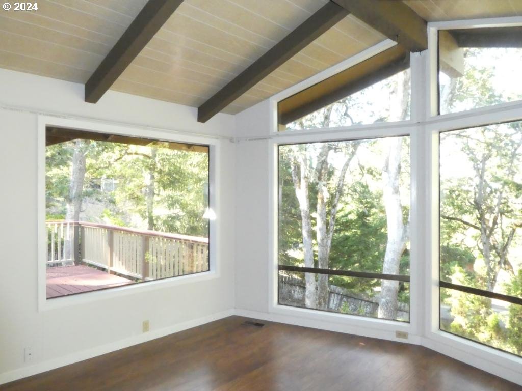310 Southeast Terrace Drive Roseburg, OR 97470 - Photo 3 of 44 a view of an empty room with wooden floor and a window