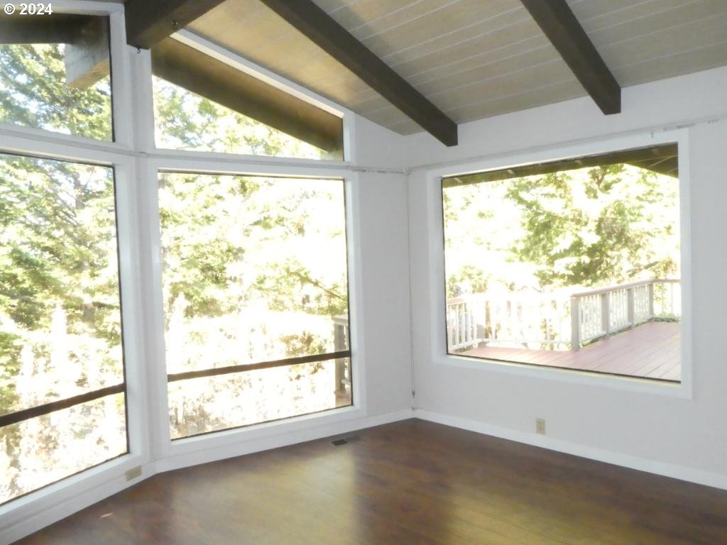 310 Southeast Terrace Drive Roseburg, OR 97470 - Photo 5 of 44 a view of an empty room with wooden floor and a window