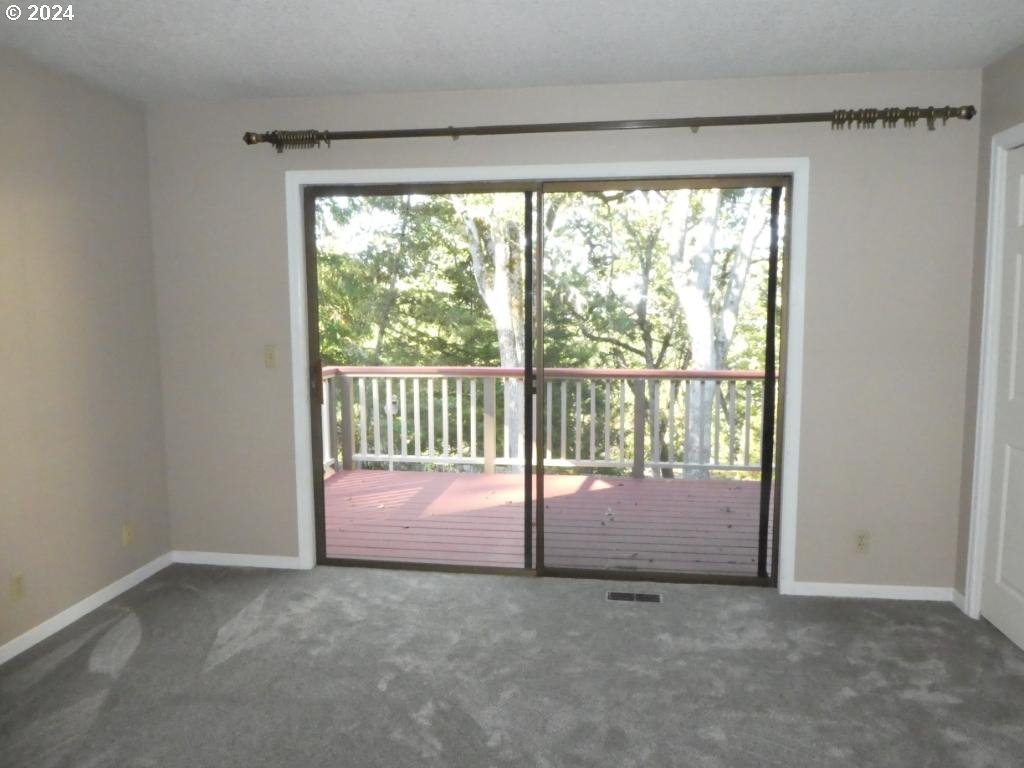 310 Southeast Terrace Drive Roseburg, OR 97470 - Photo 6 of 44 a view of empty room with floor to ceiling window