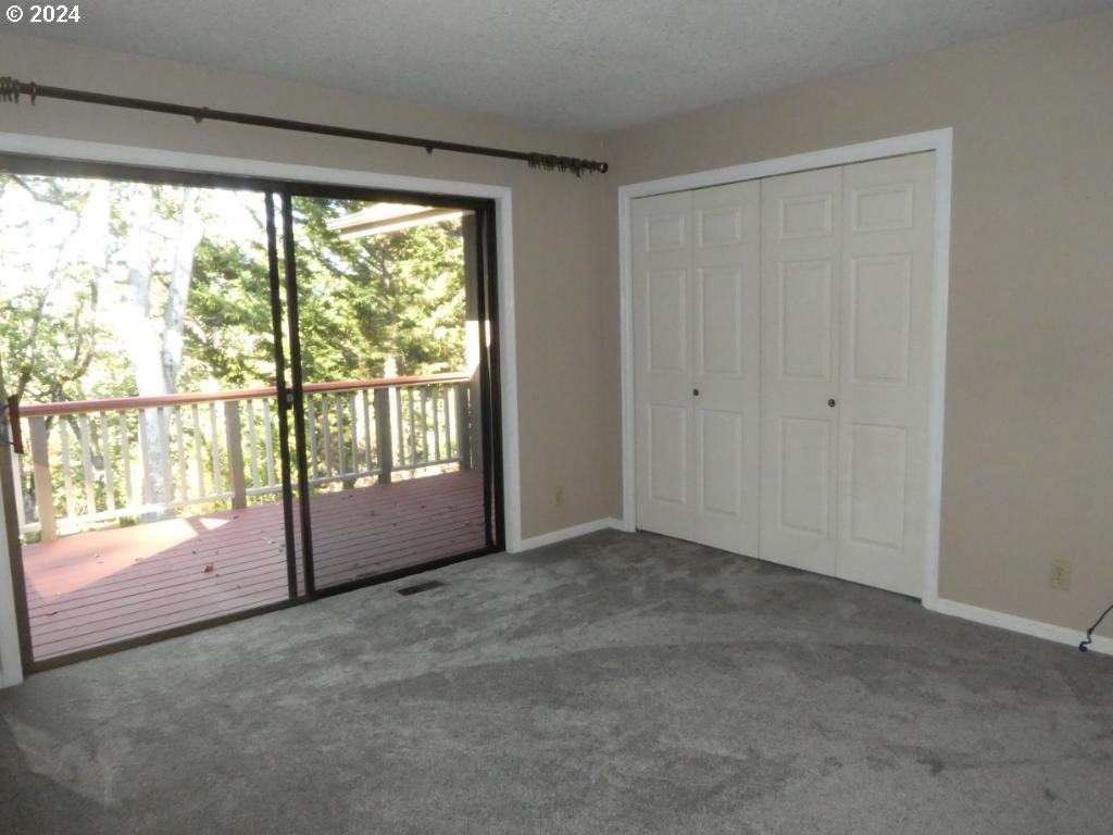 310 Southeast Terrace Drive Roseburg, OR 97470 - Photo 8 of 44 a view of an empty room with a window