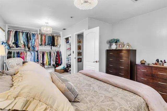 a bedroom with a bed and a closet