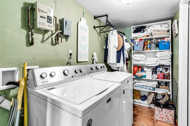 a utility room with dryer and washer
