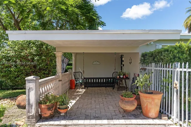 a view of a porch with furniture