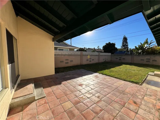 a view of a backyard of the house