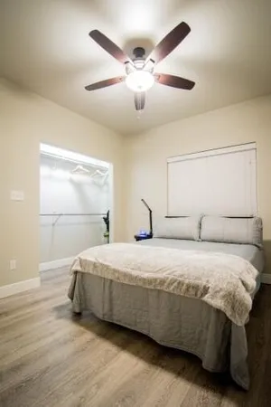 a bedroom with a bed and window