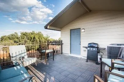 a view of a chairs and table in patio