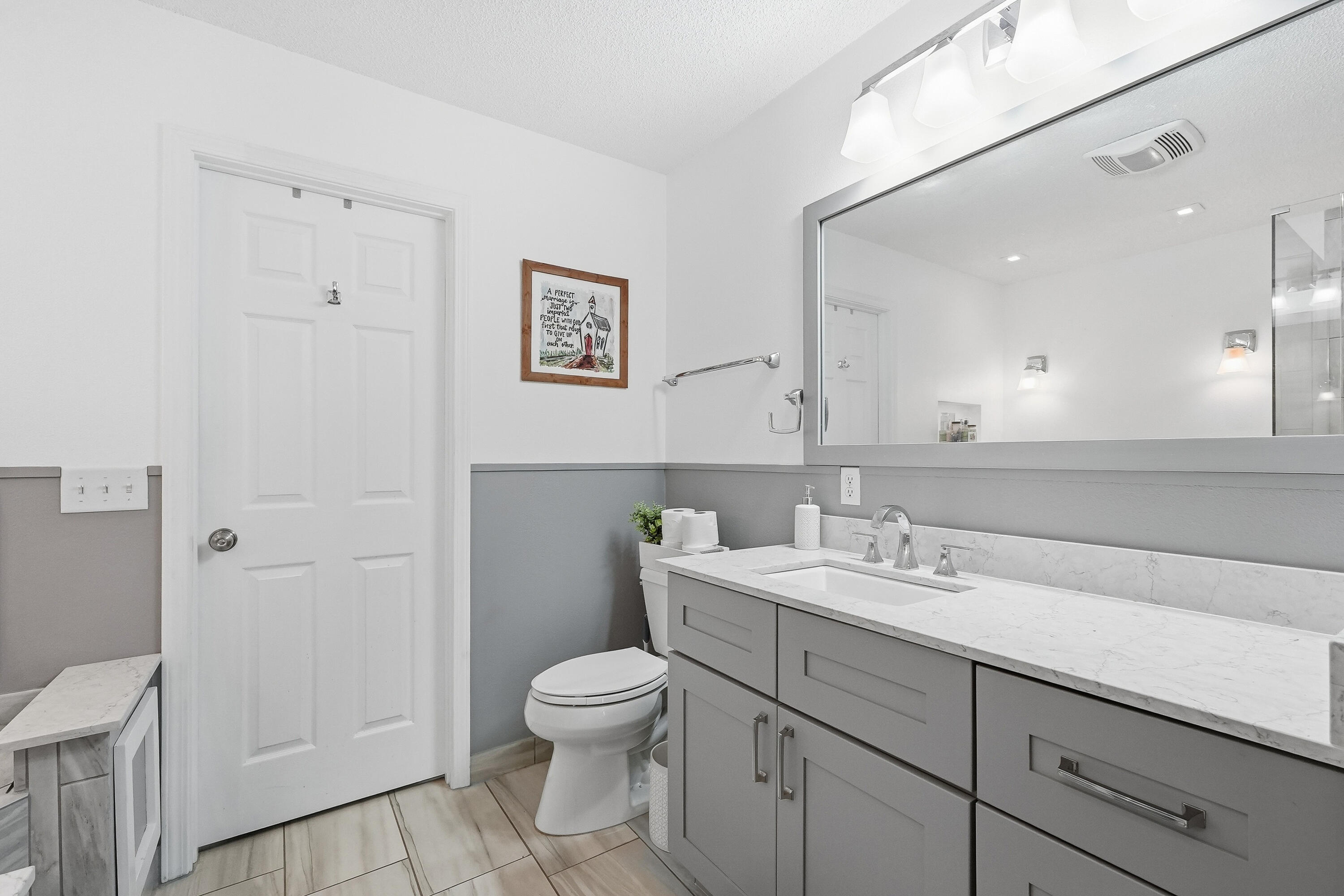 766 Randall Roberts Road Fort Walton Beach, FL 32547 - Photo 12 of 41 a bathroom with a toilet sink and mirror