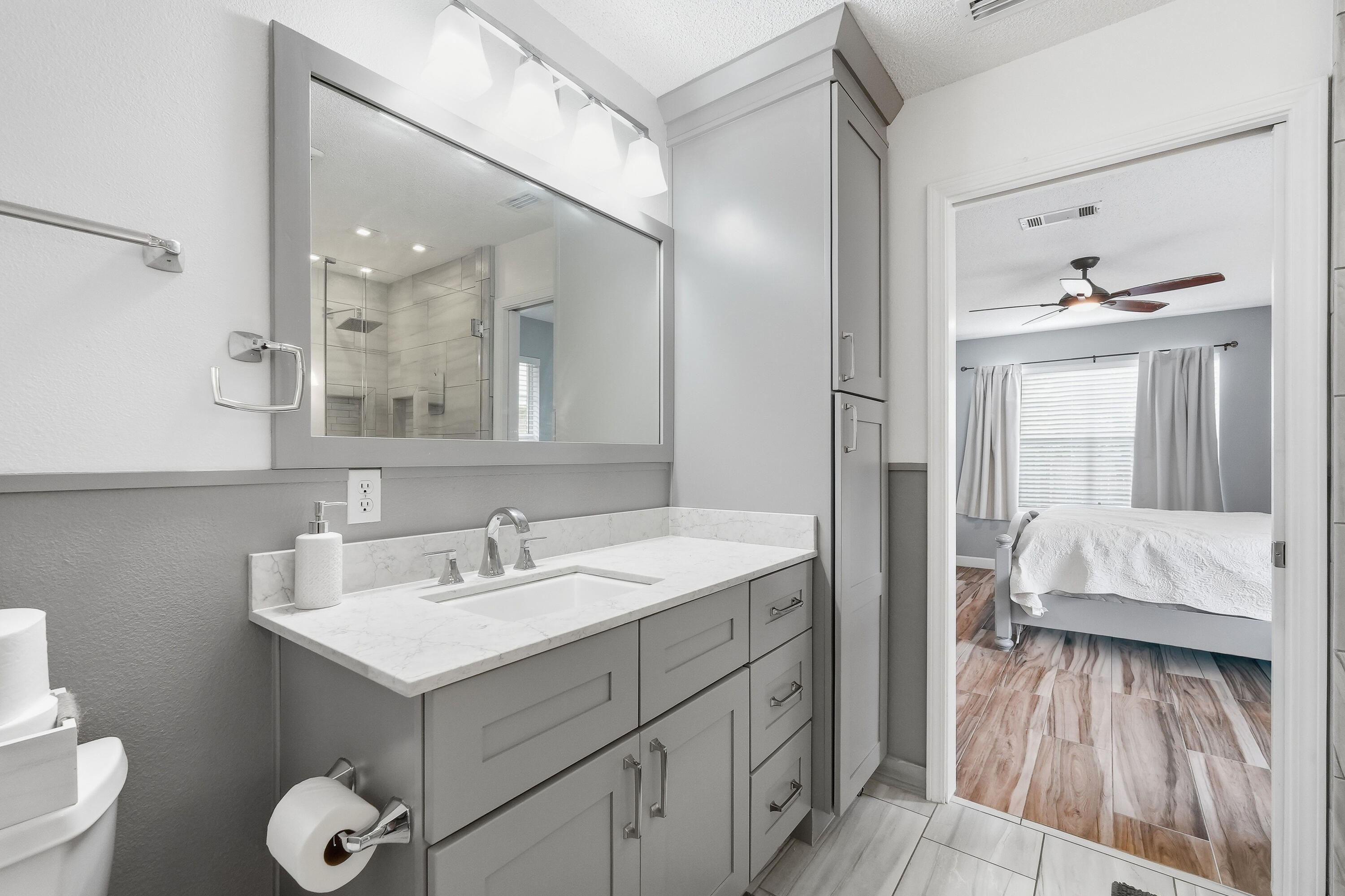 766 Randall Roberts Road Fort Walton Beach, FL 32547 - Photo 13 of 41 a en suite bathroom with a toilet sink and mirror