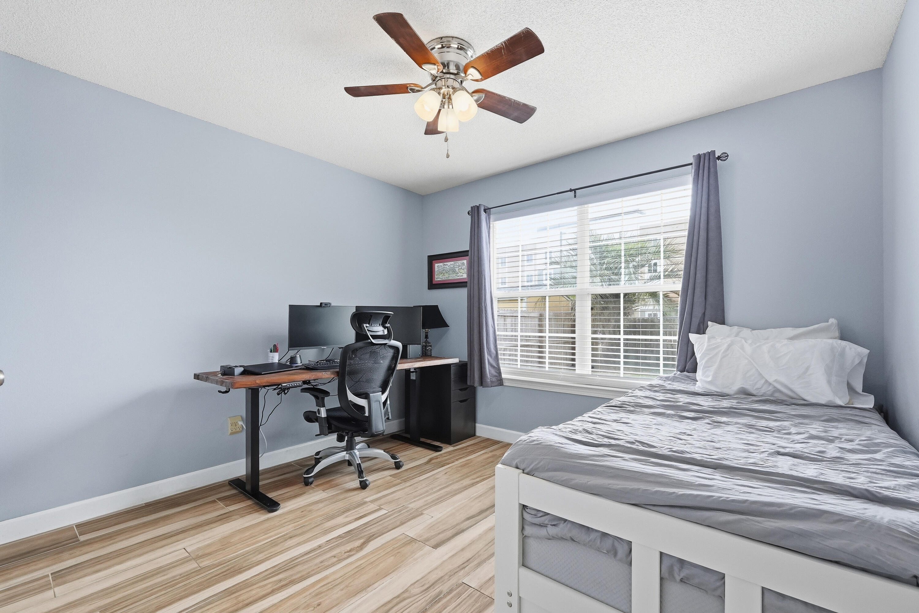 766 Randall Roberts Road Fort Walton Beach, FL 32547 - Photo 17 of 41 a bedroom with a bed and a desk