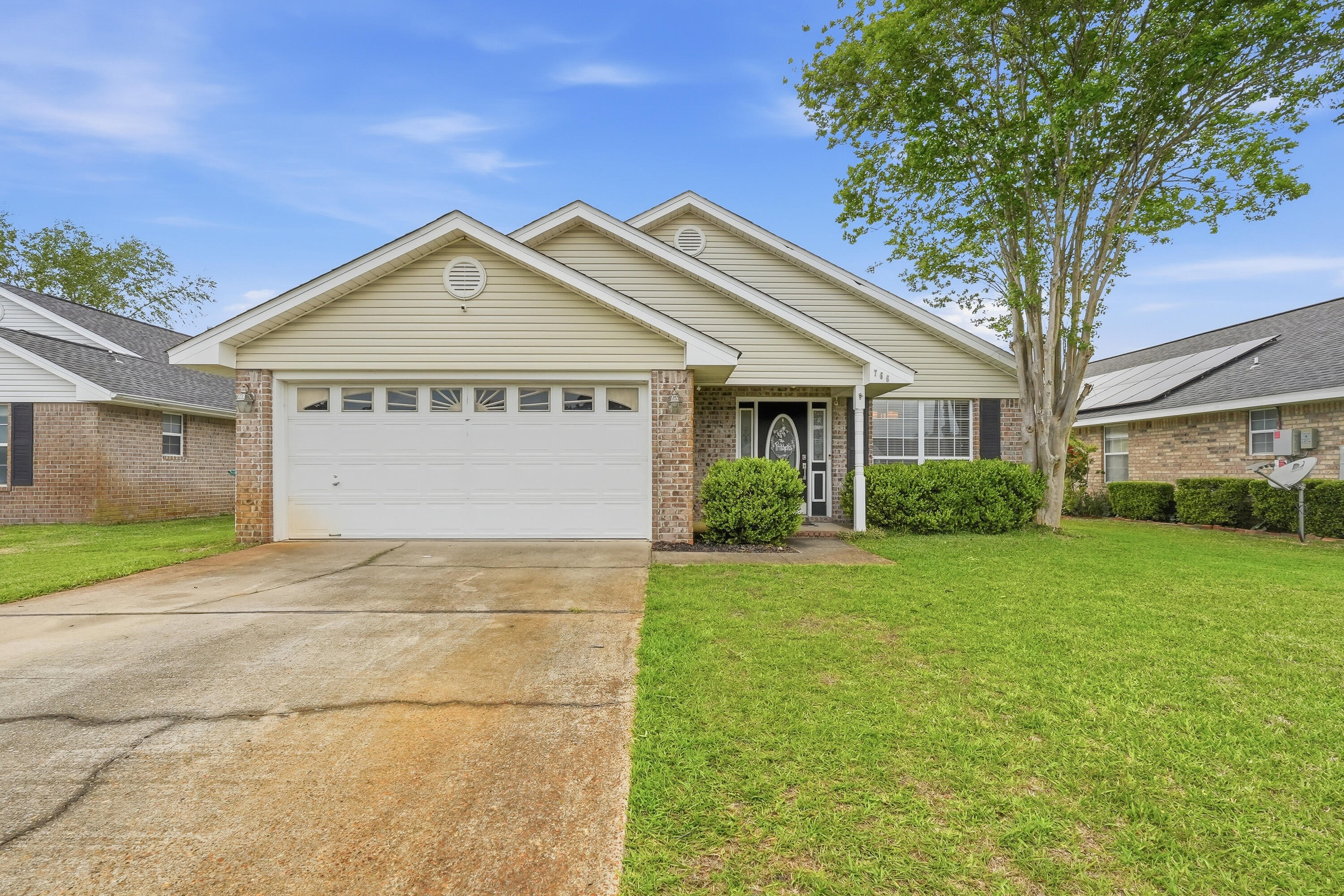 766 Randall Roberts Road Fort Walton Beach, FL 32547 - Photo 2 of 41 a view of a big house with a big yard and large trees
