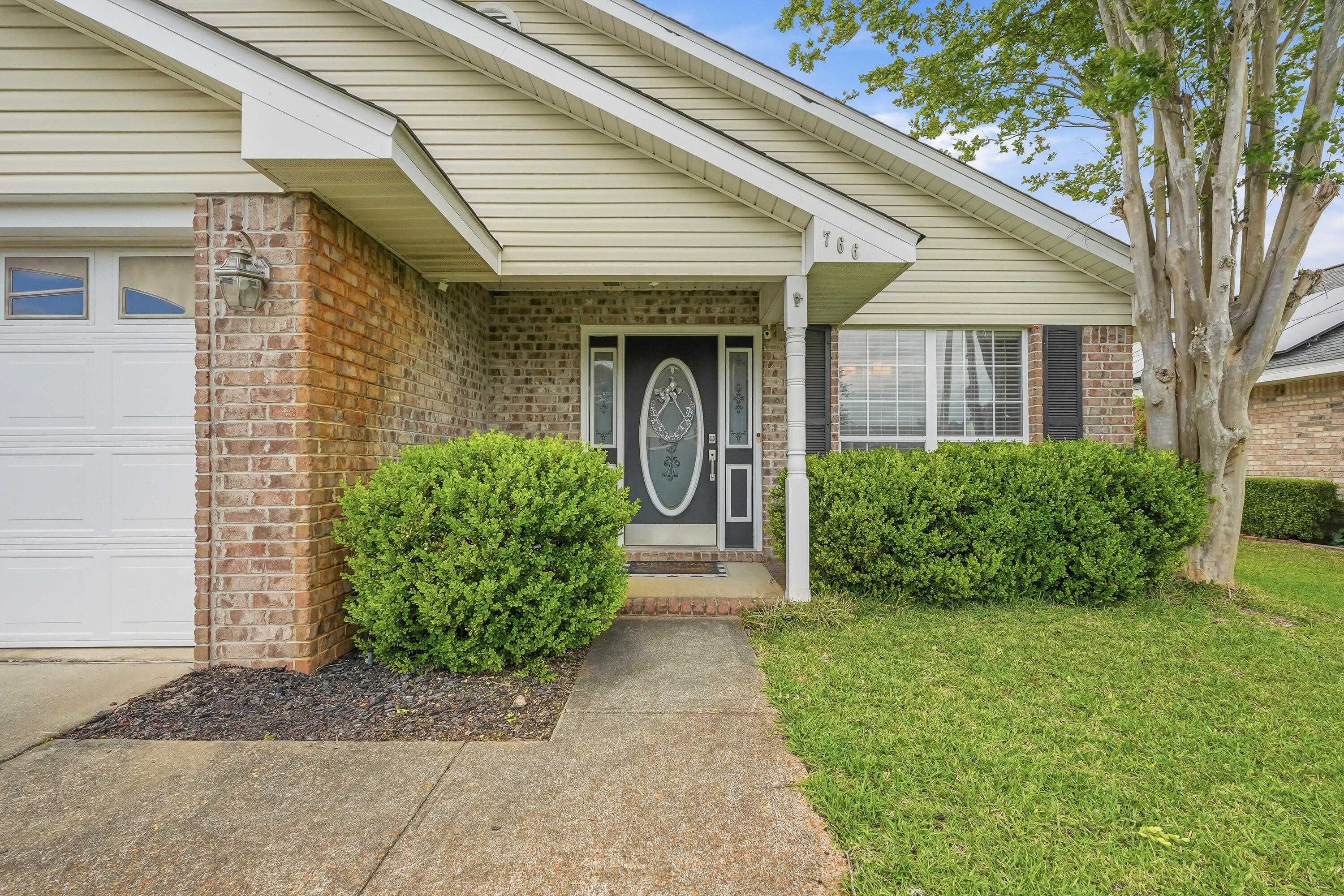 766 Randall Roberts Road Fort Walton Beach, FL 32547 - Photo 3 of 41 a front view of a house with garden