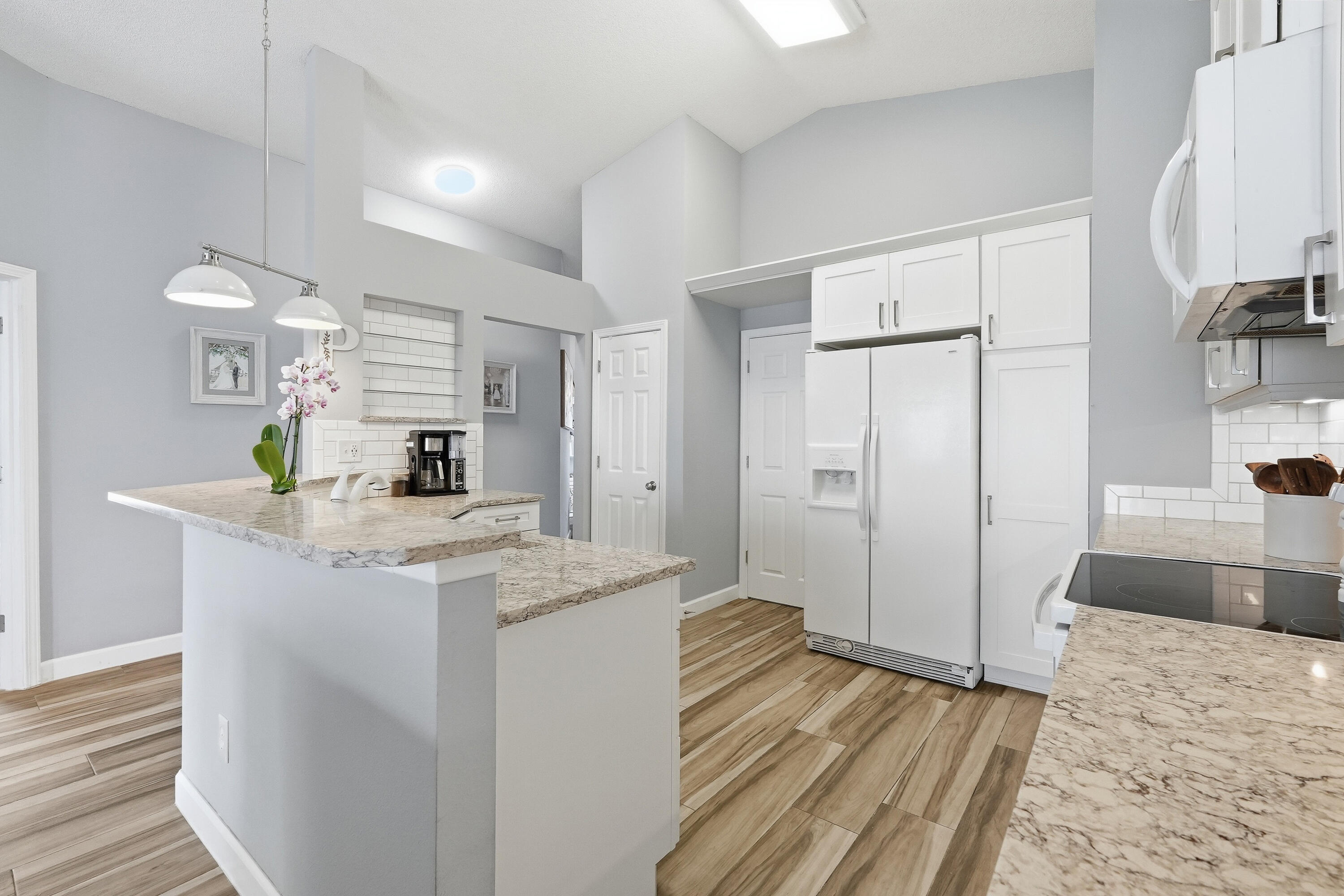 766 Randall Roberts Road Fort Walton Beach, FL 32547 - Photo 32 of 41 a kitchen with granite countertop a sink stove and refrigerator