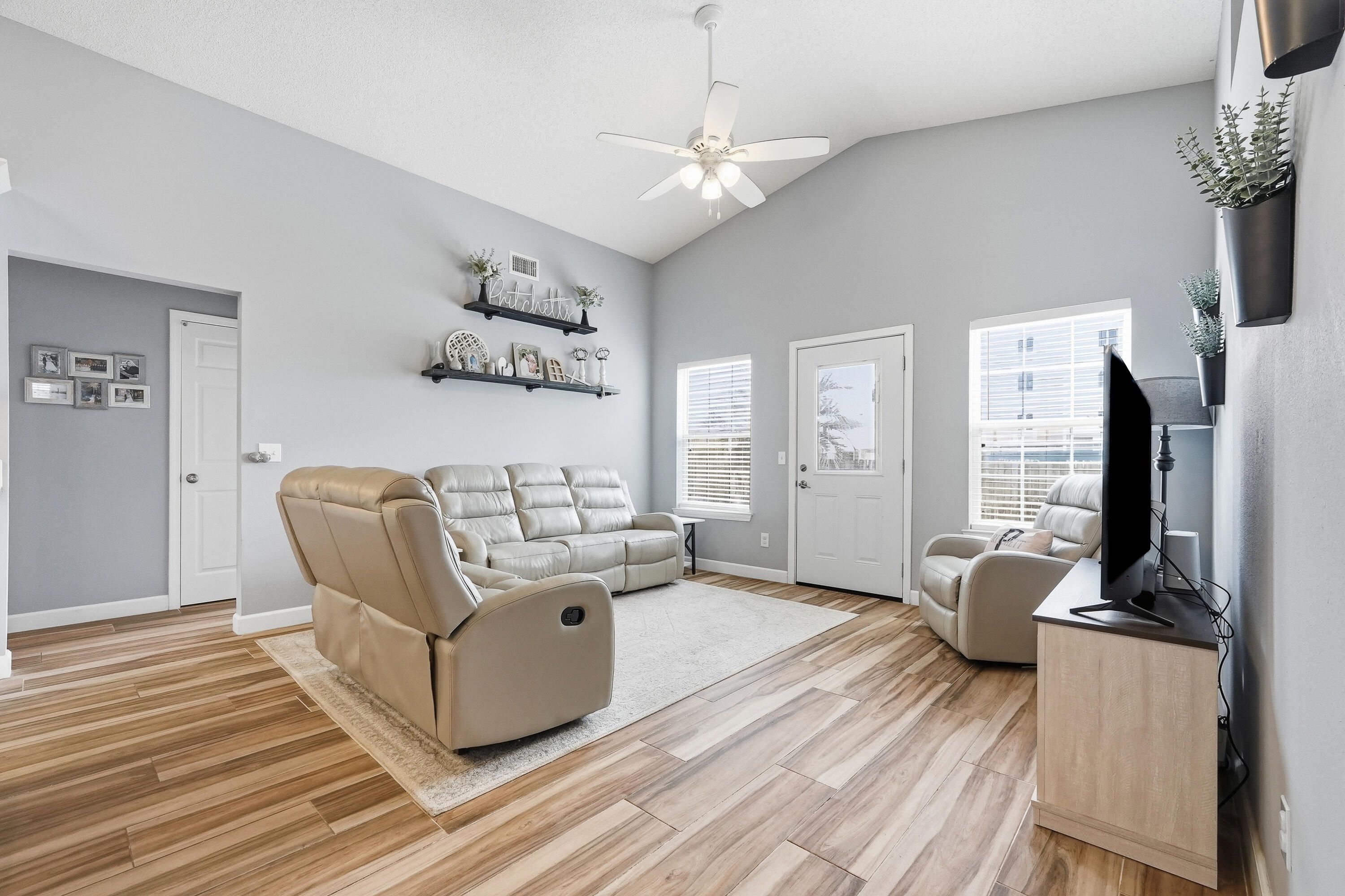 766 Randall Roberts Road Fort Walton Beach, FL 32547 - Photo 34 of 41 a living room with furniture a fireplace and a flat screen tv