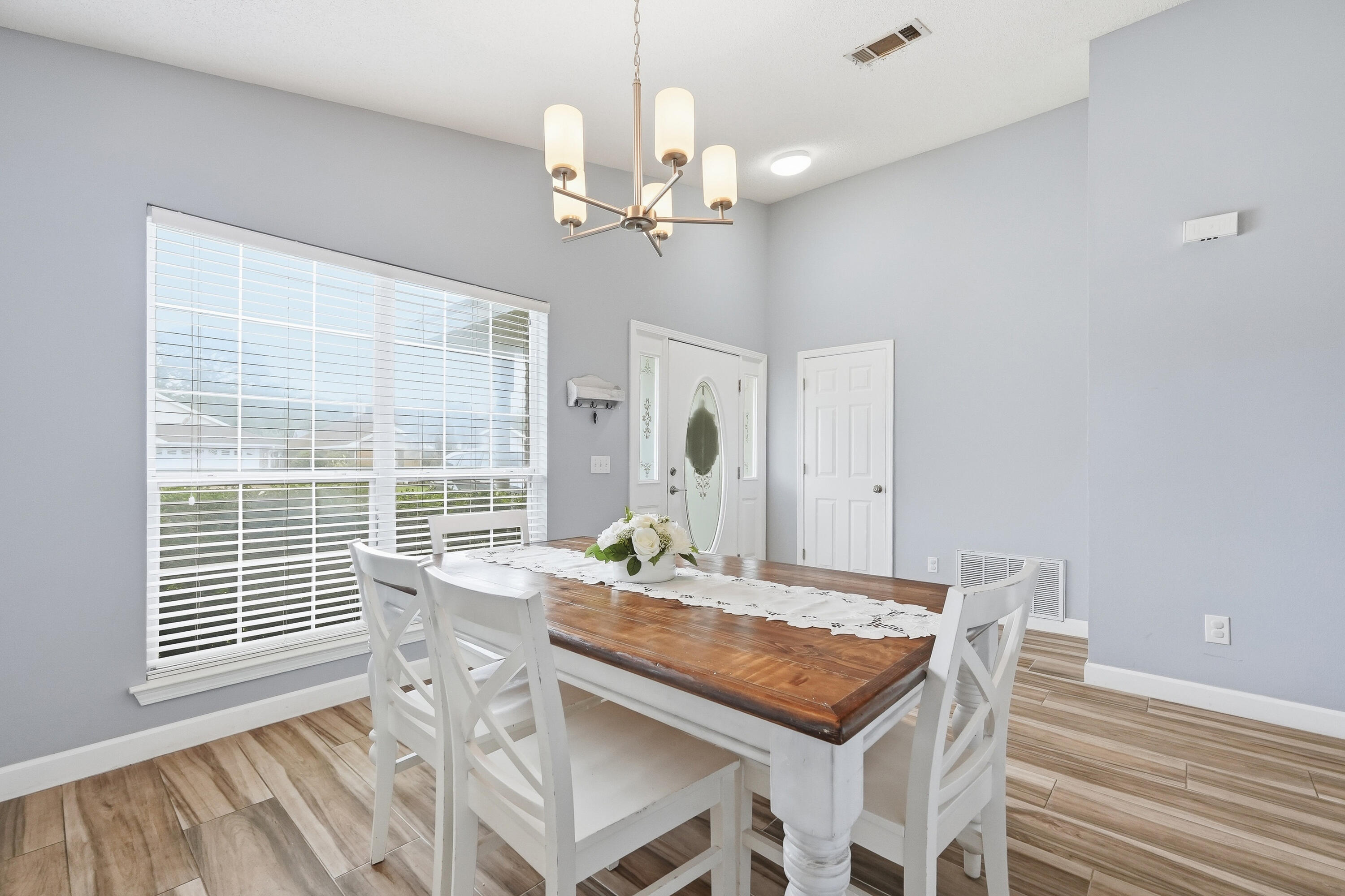 766 Randall Roberts Road Fort Walton Beach, FL 32547 - Photo 7 of 41 a view of a dining room with furniture window and wooden floor
