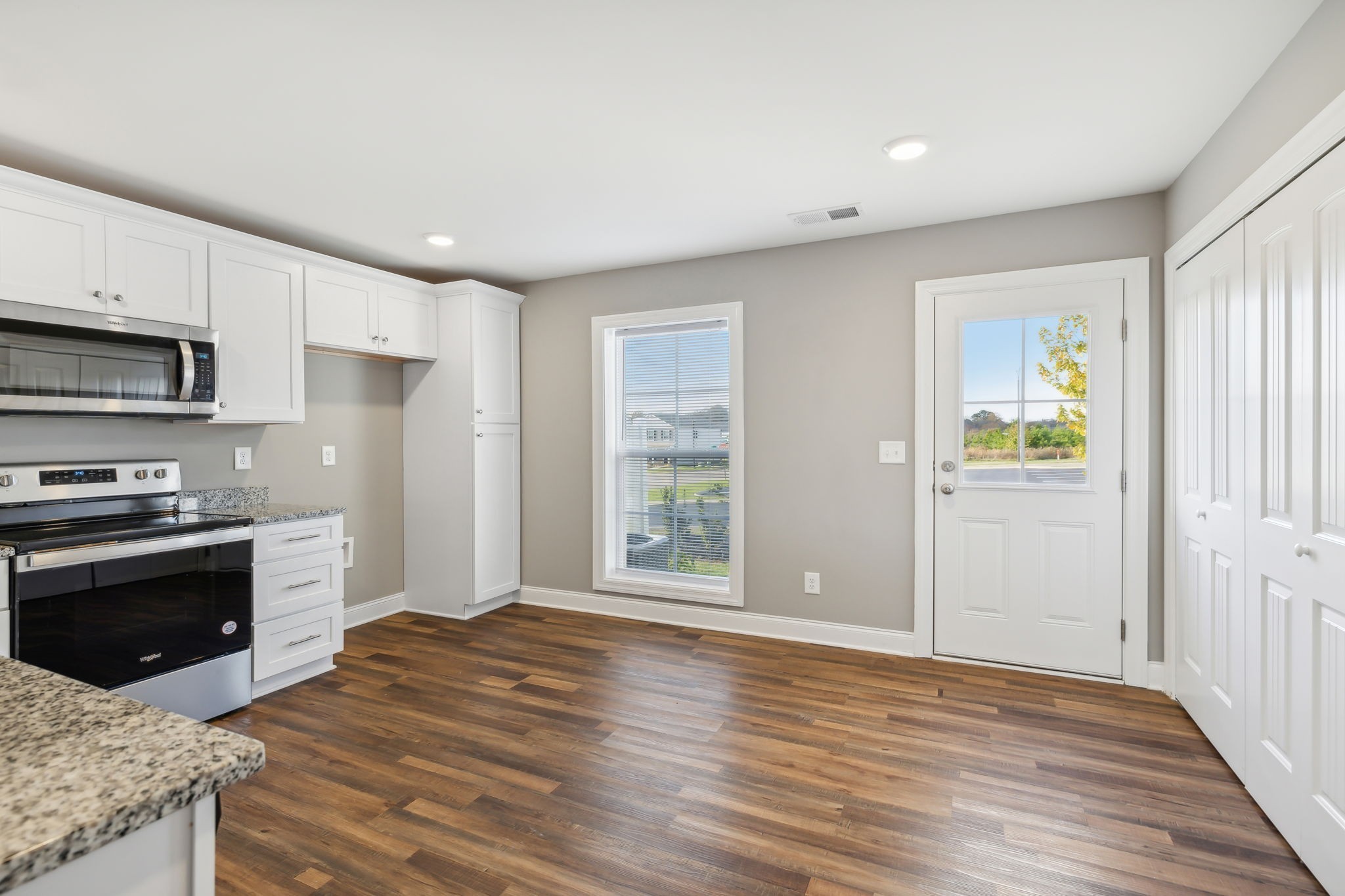 927 Sutton Cove Columbia, TN 38401 - Photo 12 of 24 a view of a kitchen with wooden floor electronic appliances and window