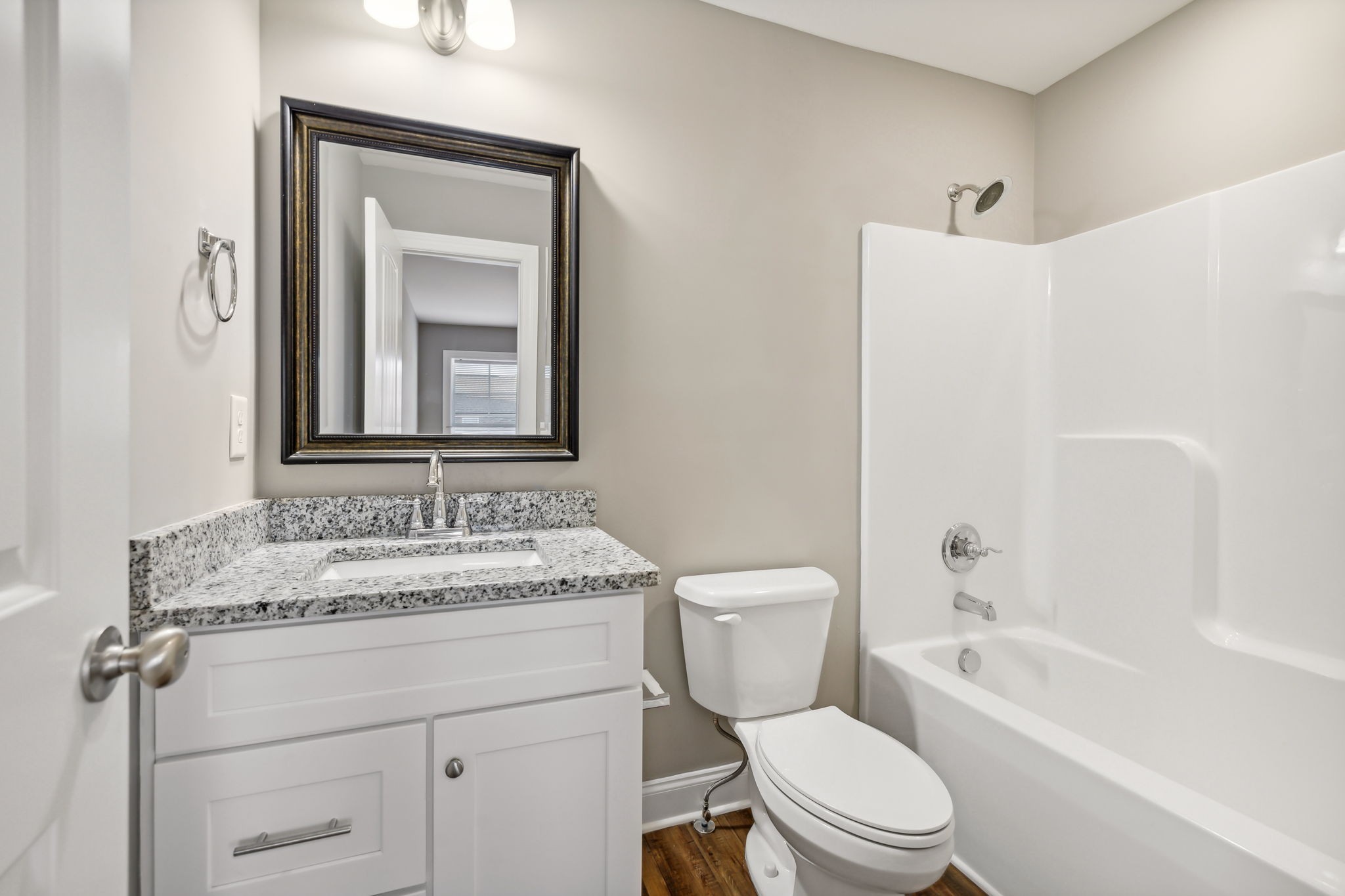 927 Sutton Cove Columbia, TN 38401 - Photo 21 of 24 a bathroom with a toilet sink and mirror with bathtub