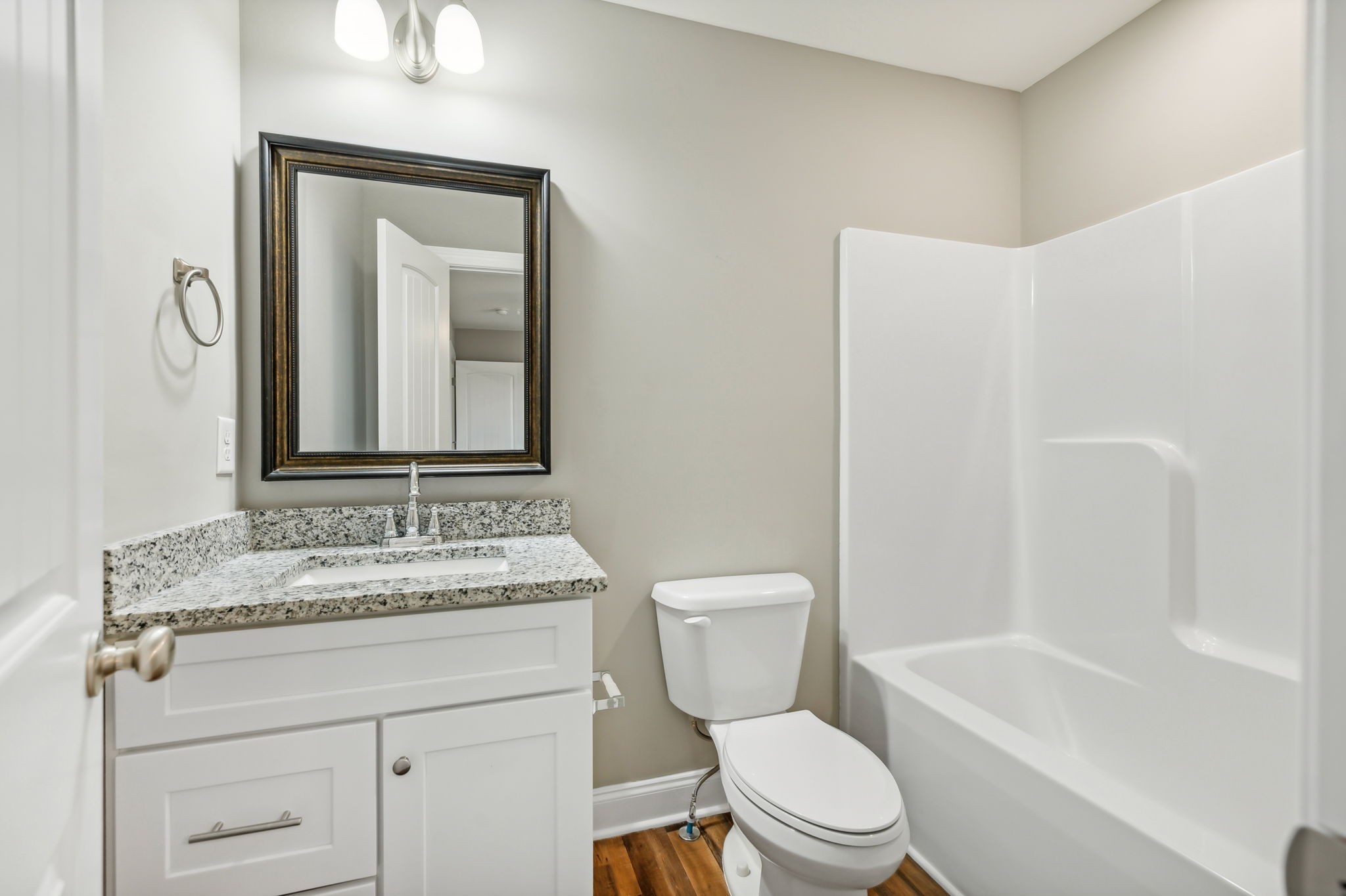 927 Sutton Cove Columbia, TN 38401 - Photo 22 of 24 a bathroom with a granite countertop toilet a sink and a mirror