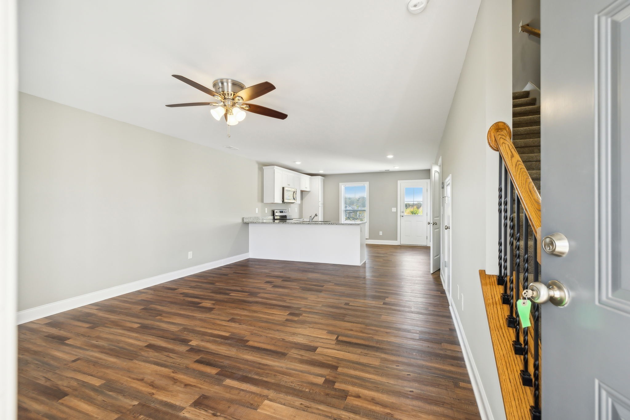 927 Sutton Cove Columbia, TN 38401 - Photo 6 of 24 a view of a livingroom with wooden floor and a ceiling fan