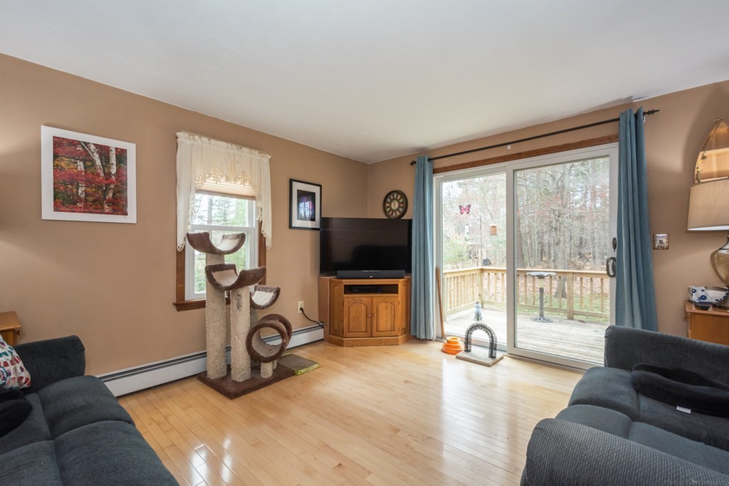 148 Walker Road Shirley, MA 01464 - Photo 12 of 35 a living room with furniture and a flat screen tv