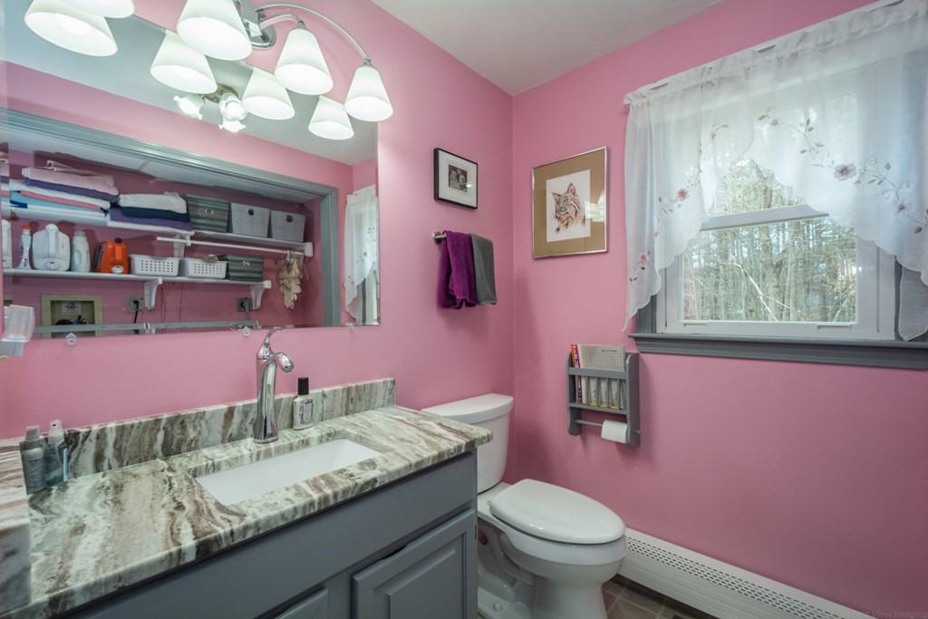 148 Walker Road Shirley, MA 01464 - Photo 14 of 35 a bathroom with a granite countertop sink mirror vanity and toilet